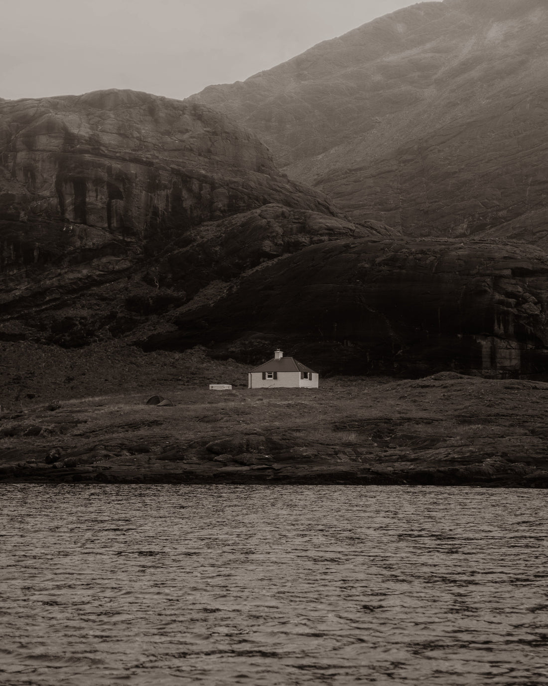 Lone house next to water